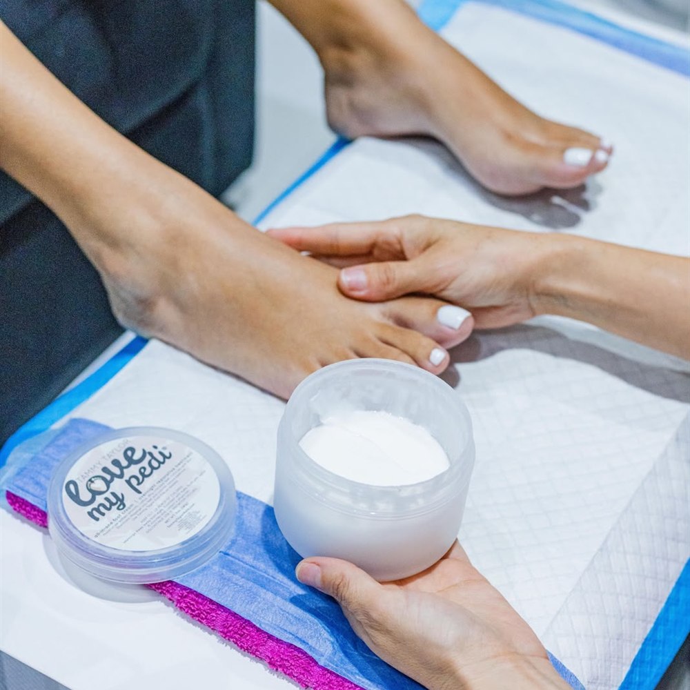 Student practicing a manicure at Bonaire Beauty Academy