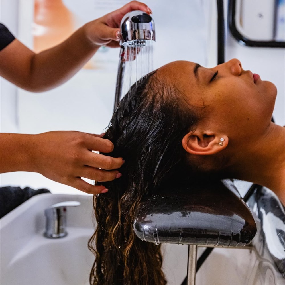 Relaxing hair wash at the salon basin